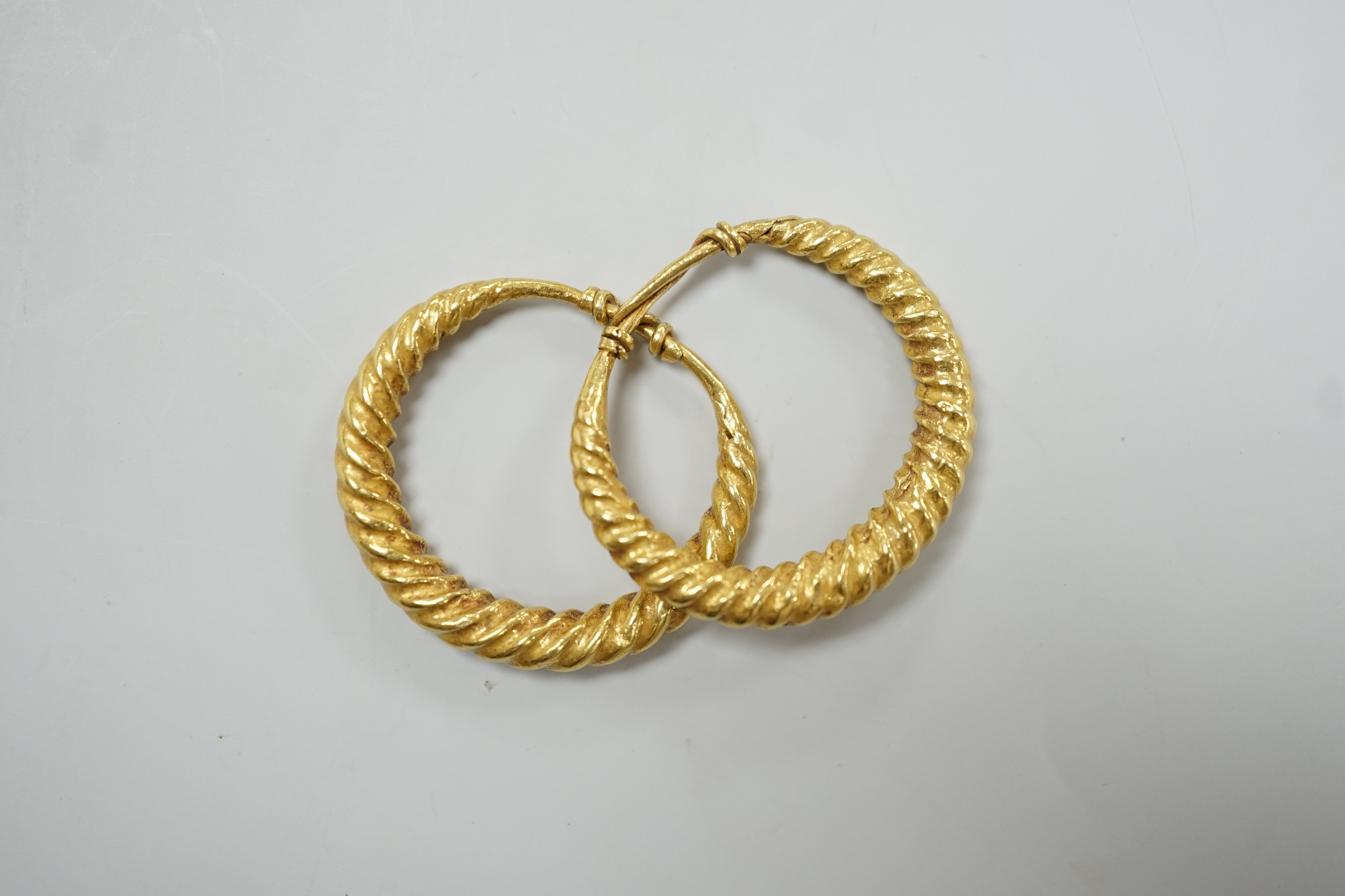 A pair of possibly Roman? yellow metal spiral twist loop earrings, 30mm, 8 grams.